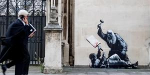 Relacionada the-mural-has-been-covered-and-is-being-guarded-by-security.jpg